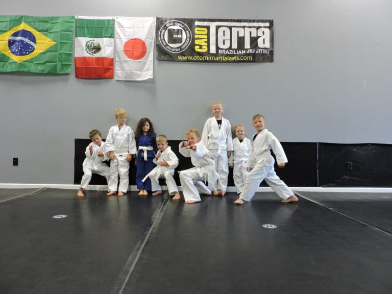 kids in jiu jitsu wearing gi