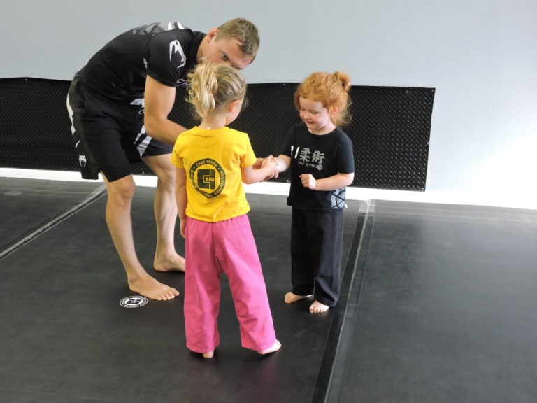 girls kids practicing jiu jitsu at the academy