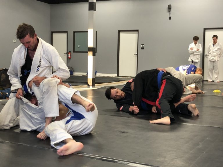 practicing adult Brazilian jiu jitsu