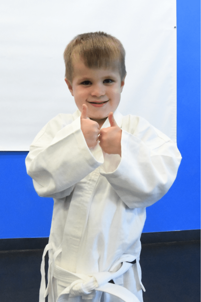 kid thumbs up at jiu jitsu dodge ball party